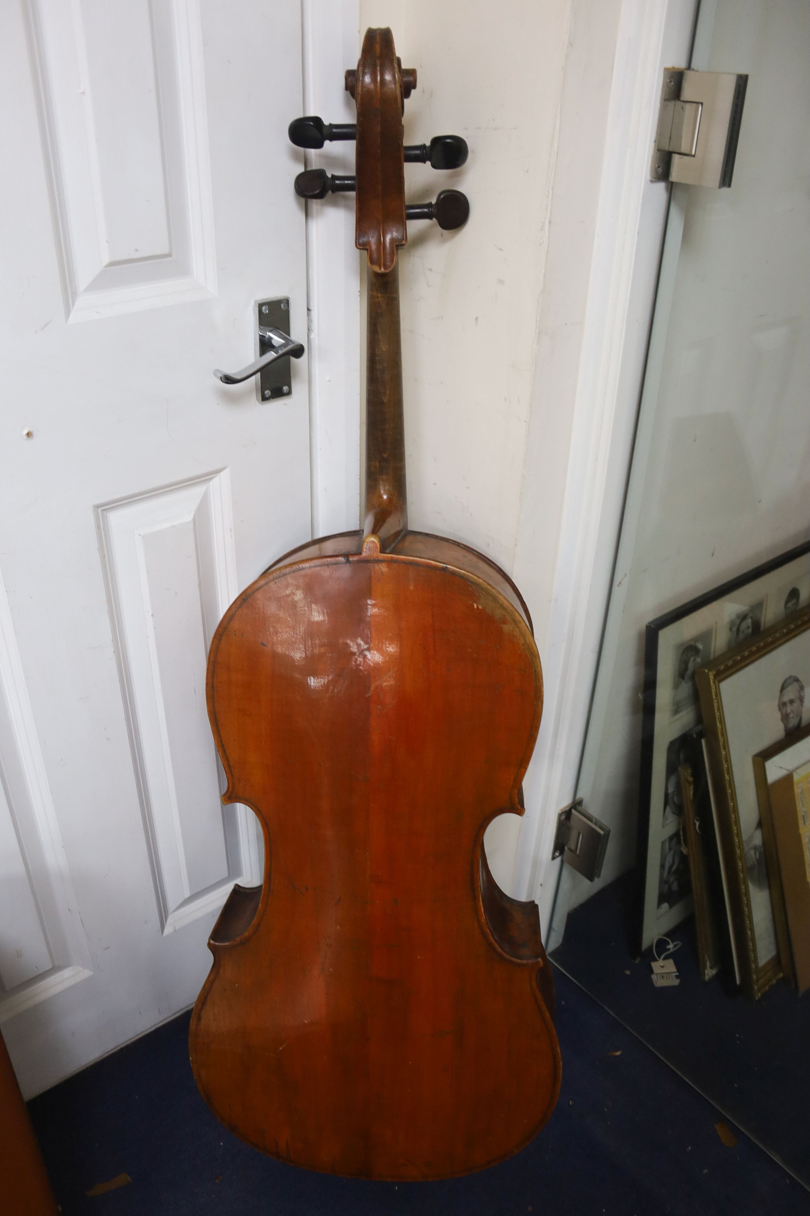 Early 20th century German cello and bow, the back measuring 75cm excluding the button